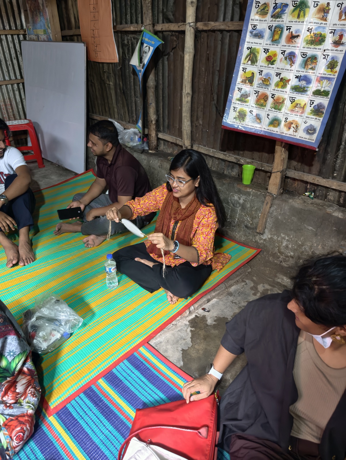 Participants seated in a circle during a hands-on making session