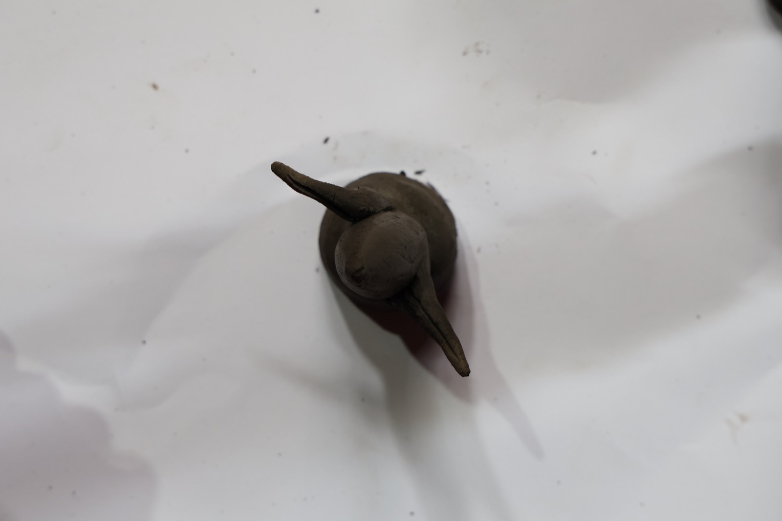 A small clay bird maquette