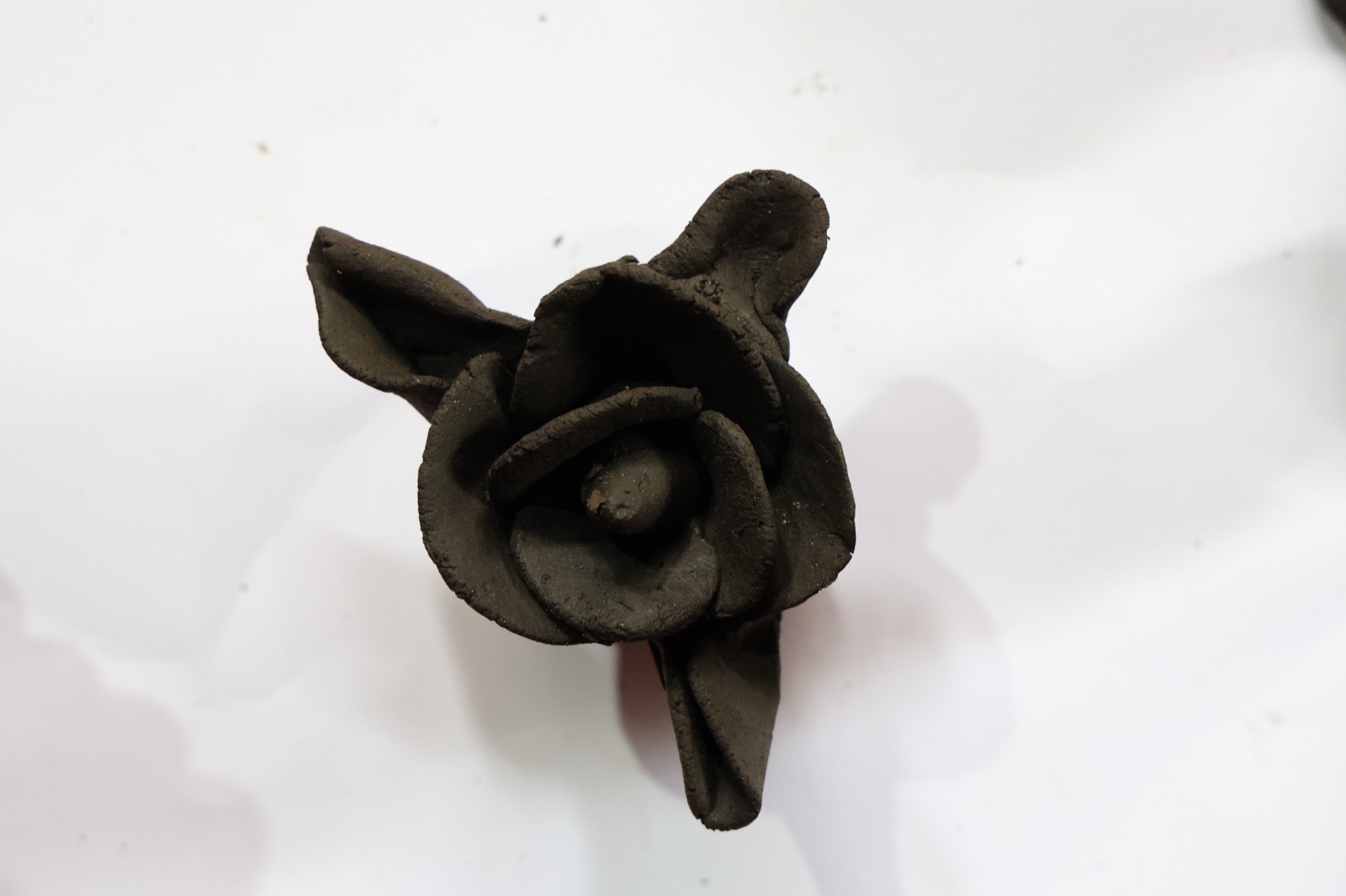 A small clay rose maquette